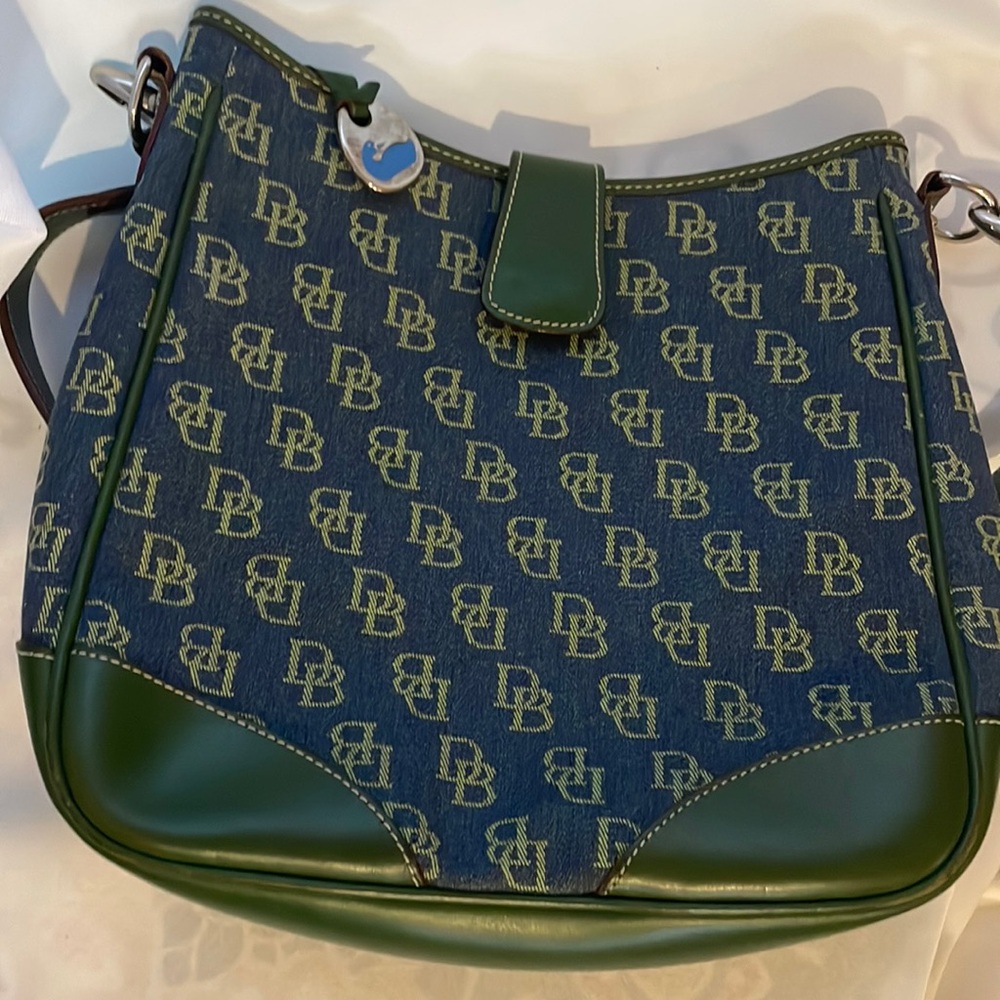 Dooney & Bourke shoulder bag with strap. Used once. Excellent condition!
